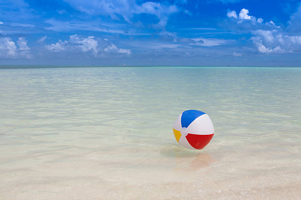 beach ball in the sea stock photo