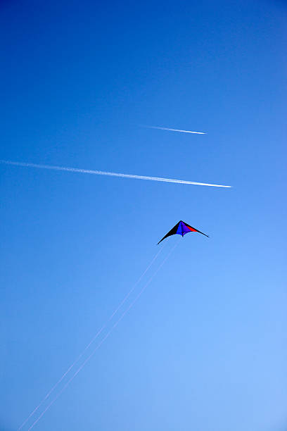 istock Kite and Aeroplanes Traces in The Blue Sky 179112815