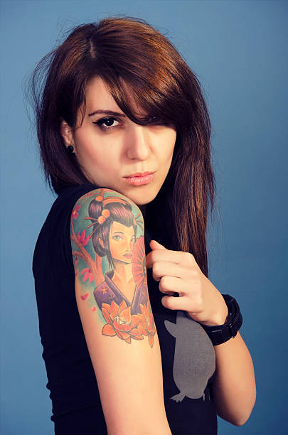 istock Woman with tattooed arm 179112950