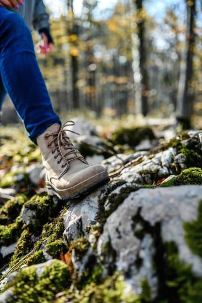 istock Leather hiking boots walking on mountain trail 1791135301