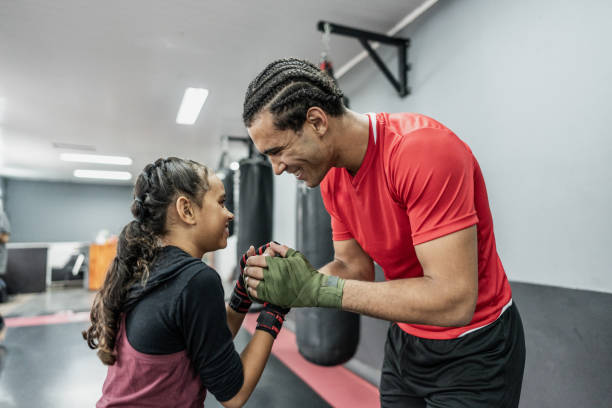 istock Boxe instructor and child girl greeting at gym 1791135855