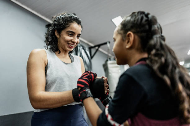 istock Boxe instructor greeting a child girl at gym 1791135877