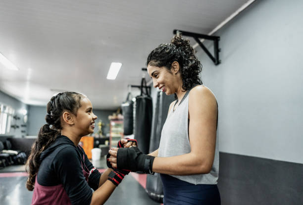 istock Boxe instructor greeting a child girl at gym 1791135881