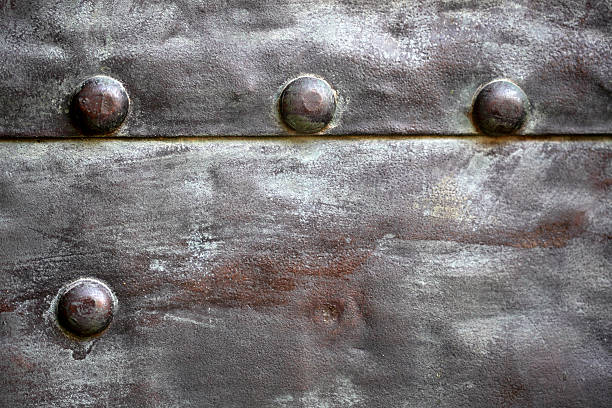 istock Black metal plate or armour texture with rivets 179113775