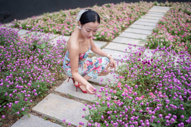 A woman picking flowers