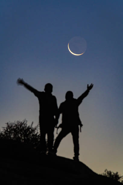 istock Two hikers are standing under the moon 1791148134