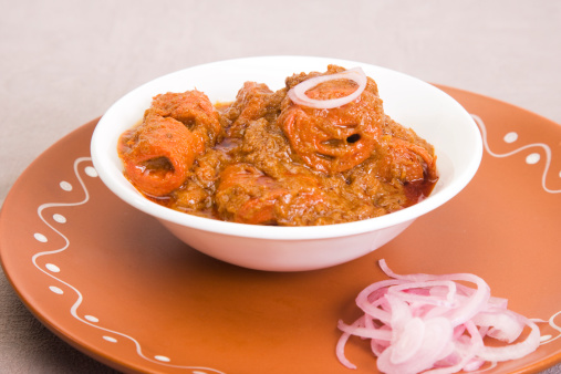 Indian home made pumpkin gravy in bowl on white background isolated