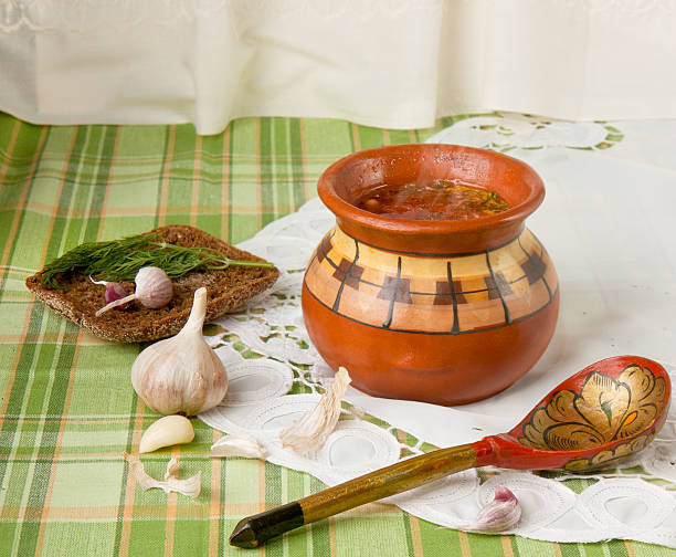 vegetable soup in a ceramic pot (borscht) stock photo