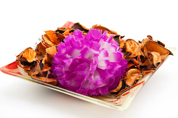 istock Potpourri in glass bowl with flower 179115310
