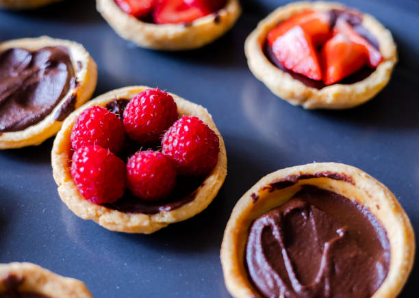 istock Chocolate-Berry Mini Tarts Close-Up on Tray 1791160522