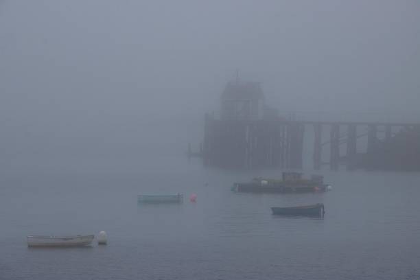 istock Fog envelopes a pier in Down East Maine 1791163938