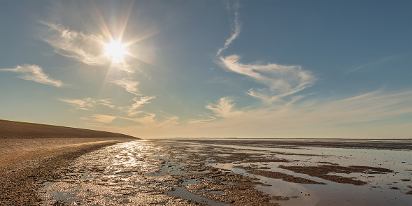 Panoramic view of the Dutch Wadden Sea with low tide in Friesland, The Netherlands