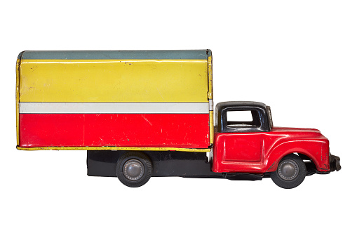 Side view of a vintage toy cargo truck with copy space isolated on a white background