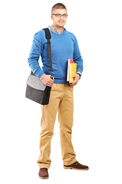 istock Smiling male student with bag holding notebooks 179117041