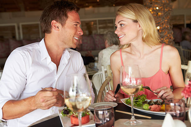 istock Couple Enjoying Meal In Restaurant 179117659