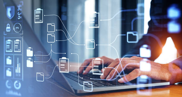 istock Businessman typing in laptop, document management system hologram 1791179230