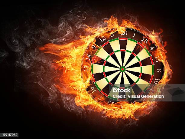 A Vintage Darts Board Smothered In Flames Stock Photo - Download Image Now - Darts, Dart, Dartboard