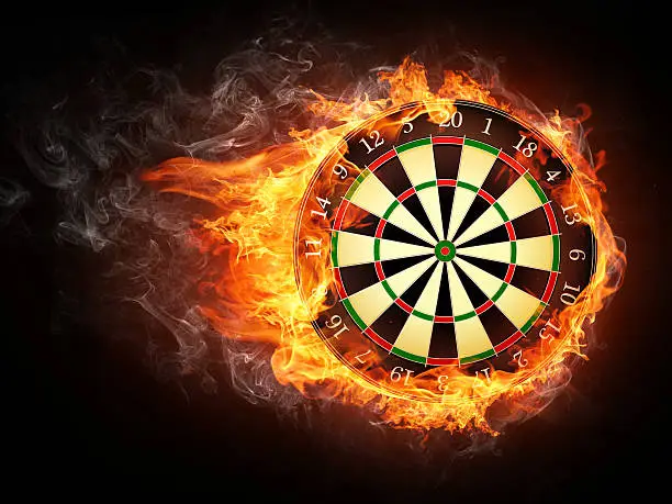 Darts Board in Fire Isolated on Black Background.