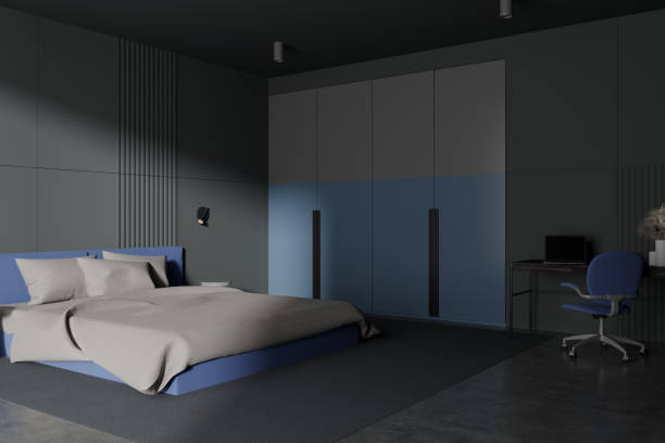 istock Gray and blue bedroom corner with workplace and wardrobe 1791182179