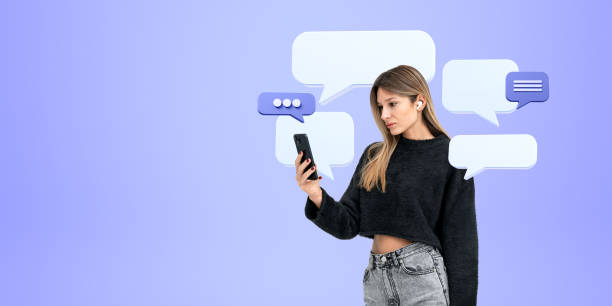 istock Young woman with phone in hand, mock up text message bubbles 1791182511