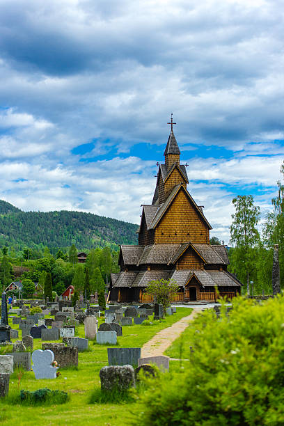 Heddal Stave Church A shot of the stave church in Heddal with his cementary. heddal stock pictures, royalty-free photos & images