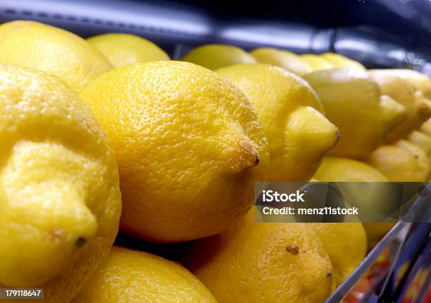 Colorful Lemons Stack On Shelf Stock Photo - Download Image Now - Awe, Business, Choice