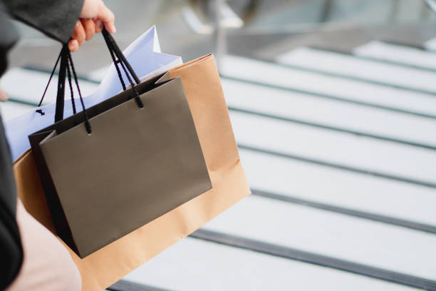 istock hand holding a shopping bag 1791189776
