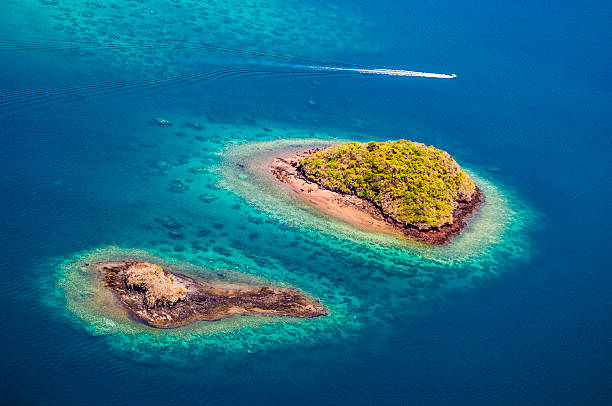 aerial view, island, lagoon, coral reef, Island, aerial view, Mayotte Aerial view of Mayotte's lagoon, coral reef, islands and boat. comoros stock pictures, royalty-free photos & images