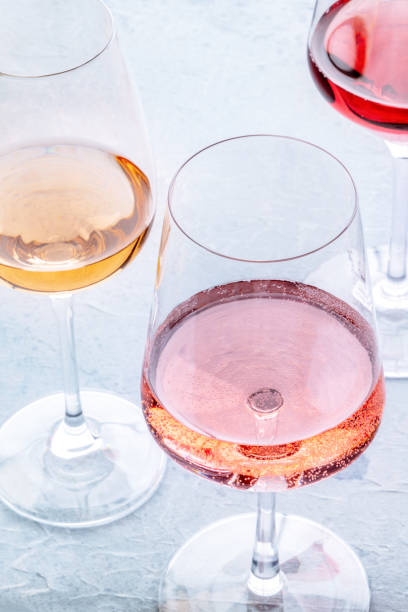 istock Wine glasses at a tasting. Rose, red, and white wine, drinks on a table 1791200858
