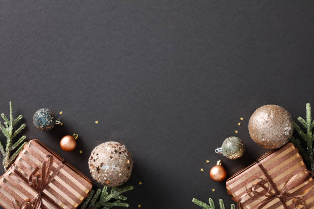 istock Chic Christmas flat lay composition on dark background. Elegant design with copper color balls decorations, gift boxes, and festive decor. Luxury holiday concept for greeting card, invitation, poster 1791201425