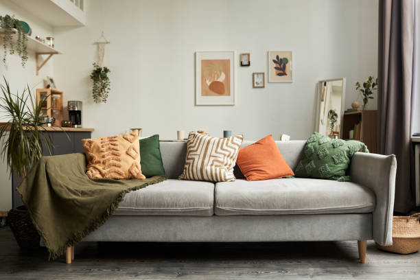 istock Cozy home interior with focus on couch and textile decor 1791202691