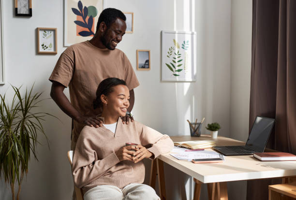 Young Black couple enjoying simple living at home