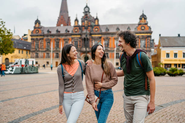 istock Three Young Friends Walking On The Stortorget Square In Malmo In Sweden 1791205110