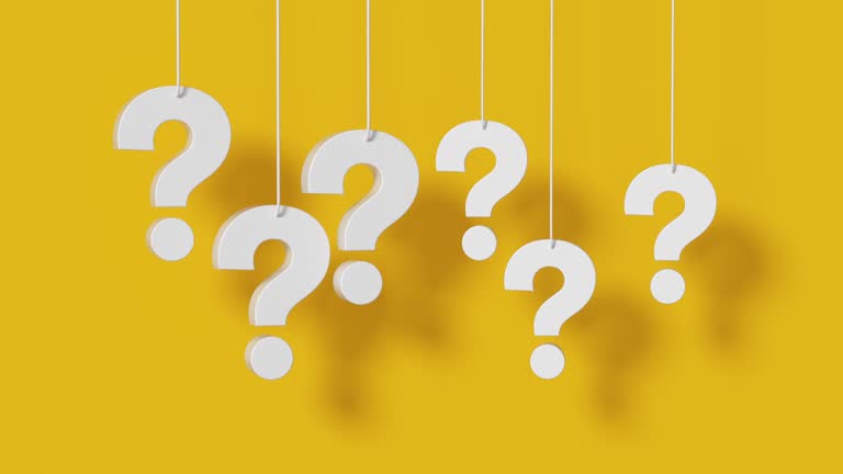 Many question mark hanging on yellow background.