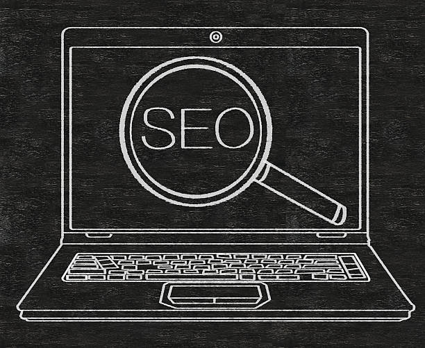 Search Engine Optimization SEO written on blackboard background stock photo