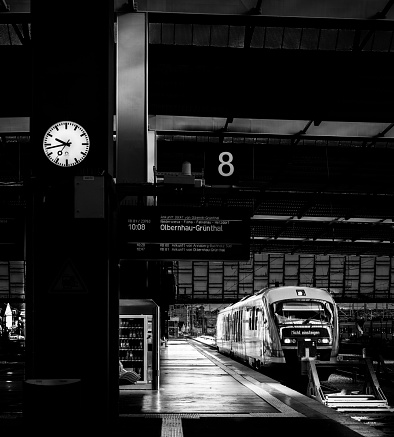 London, UK - Feb 27, 2024 - 1:31 p.m. on The station clock and platform number 3 and 4 indicators in the Acton Town station. Travel transportation, Space for text, Selective focus.