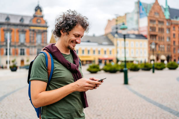 istock Young Man Using Smart Phone On The Stortorget Square In Malmo In Sweden 1791221237