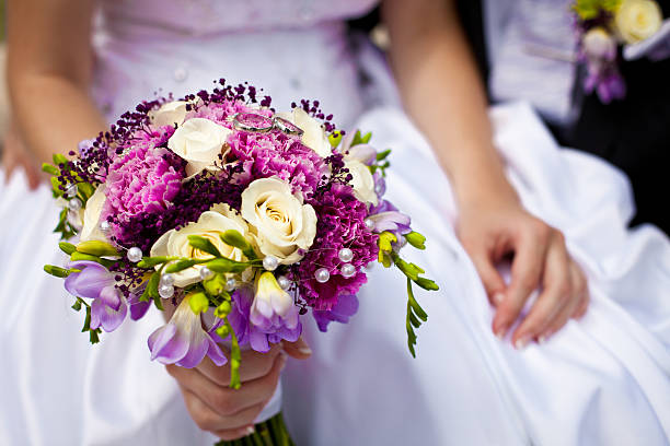 istock Newlyweds with wedding flower 179122275