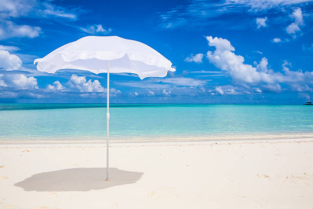 istock white sunshade  at the beach 179122605