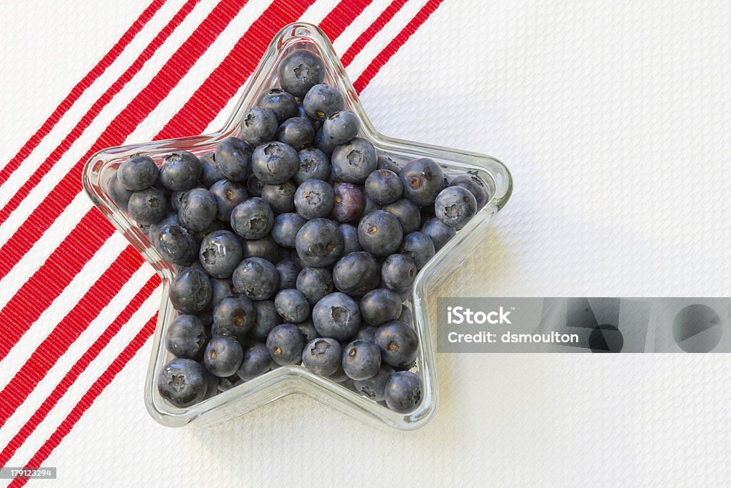 Blueberries in a Star Shaped Dish Fresh blueberries in a star shaped dish on a red striped towel Antioxidant Stock Photo