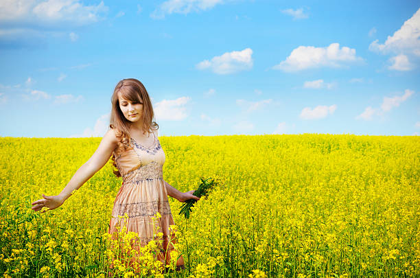 istock Young woman at canola field 179123540
