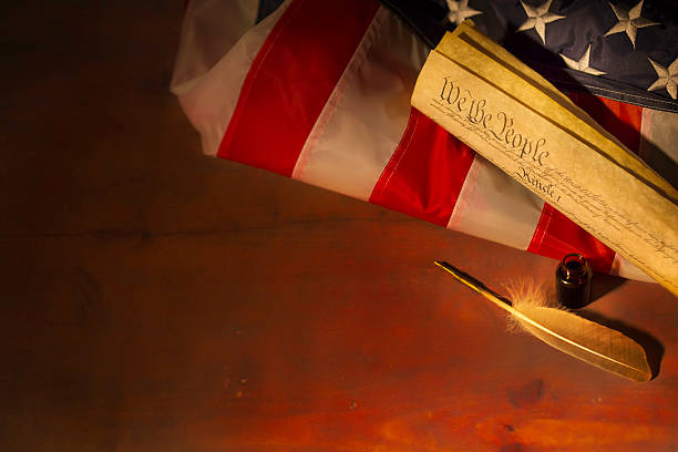 American flag blended with the United States Constitution for use as a symbol of laws, freedom and separation of government powers.
