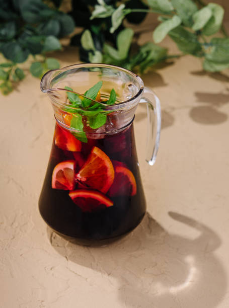 istock Full jug of pomegranate juice with lemon 1791242483
