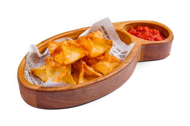 potato crisps with hot sauce isolated