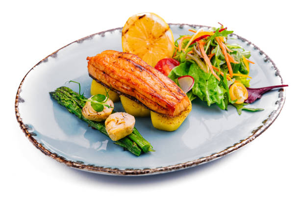 istock salmon with asparagus and artichoke isolated on white 1791242872