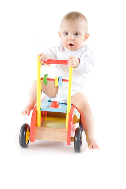 istock Baby on toy push car 179124511