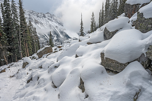 Snow covered rockslide in Banff National Park, Alberta, Canada