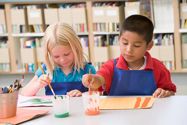 istock Kindergarten children painting 179124794