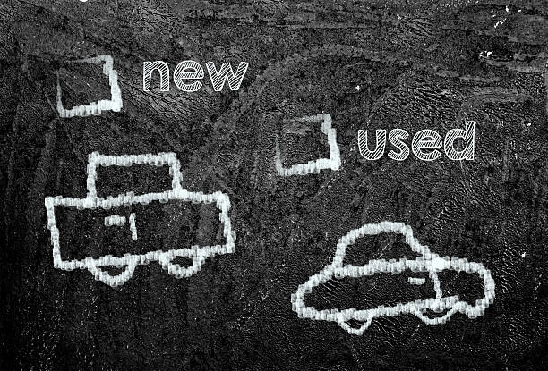 istock new or used car on blackboard 179125175