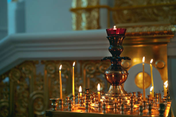 istock burning wax candles in a gilded candlestick in orthodox cathedral 1791255355
